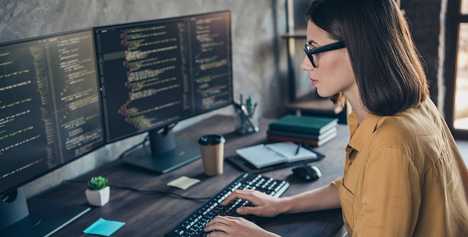 woman coding on a computer