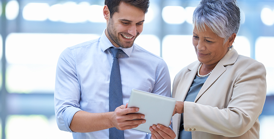 two business associates comparing notes