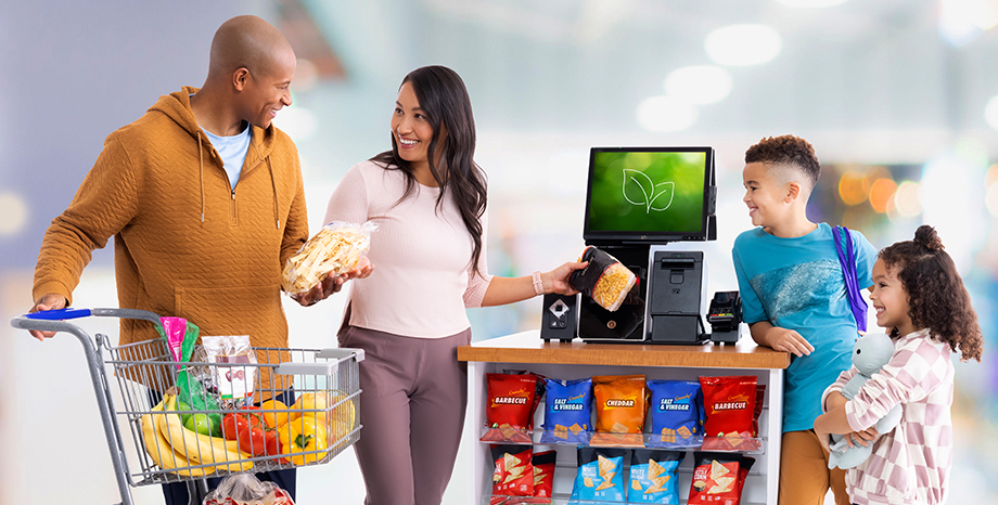family using EASY ONE kiosk to checkout purchase