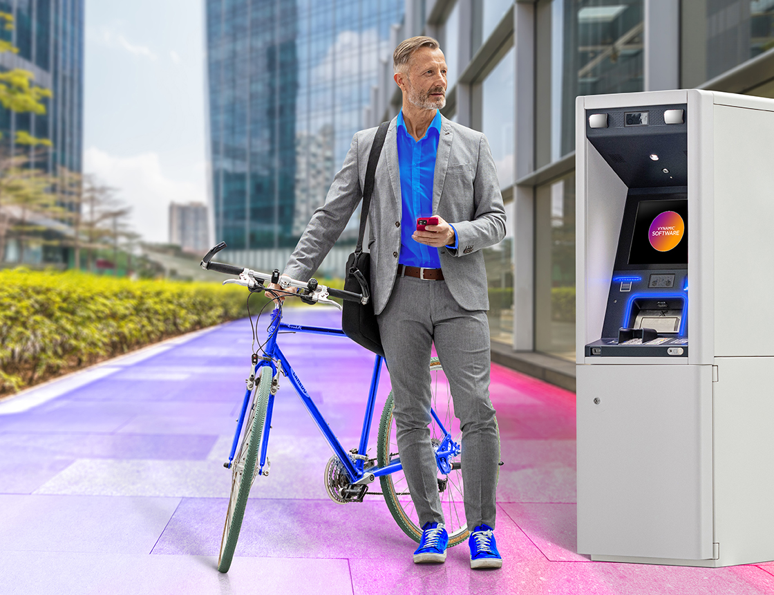 man with a bike using ATM