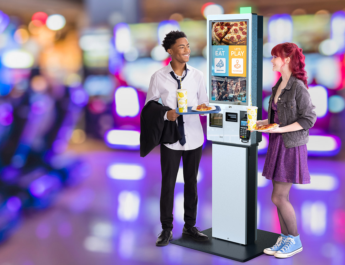 Two People ordering at self-ordering kiosk