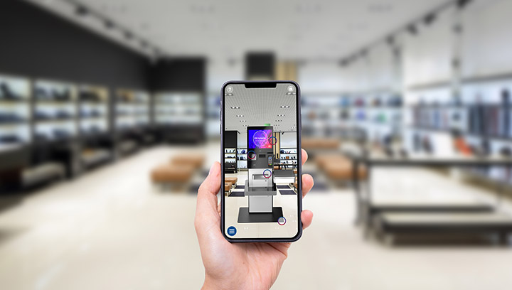 Hand holds a smartphone infront of a room visualizes how different retail point-of-sale solutions could work in the space
