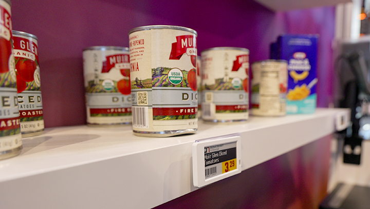 ESL display on a shelf with canned goods