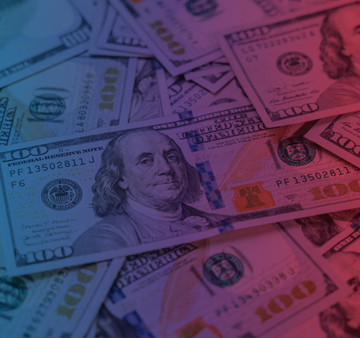 Dollar bills spread across