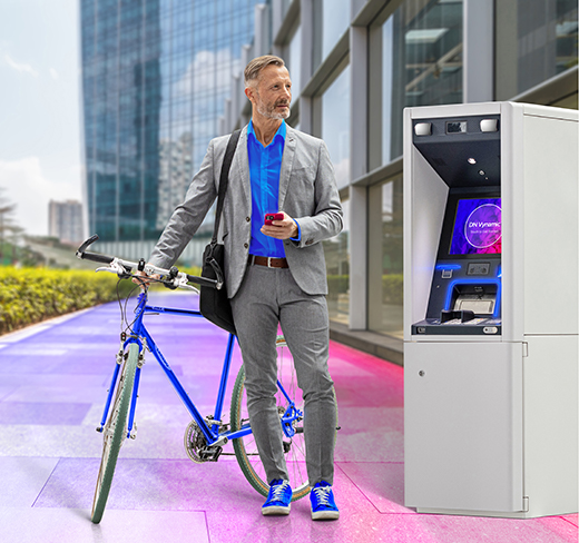 man with a bike using ATM