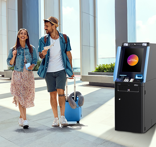 2 people walking by theDN Series® 300 Lobby ATM