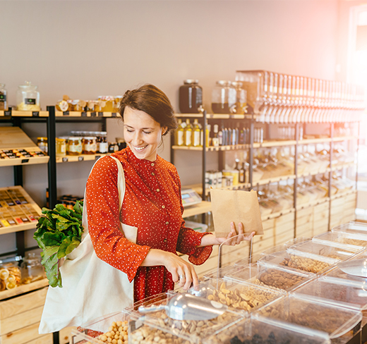 Woman browsing produce in a grocery store