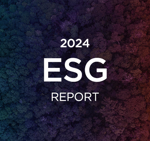 Woman holding tablet viewing Diebold Nixdorf's ESG Report 2024