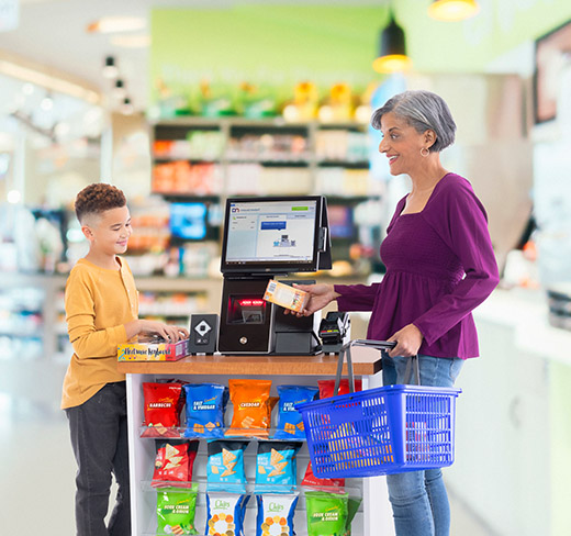 woman and child using self checkout